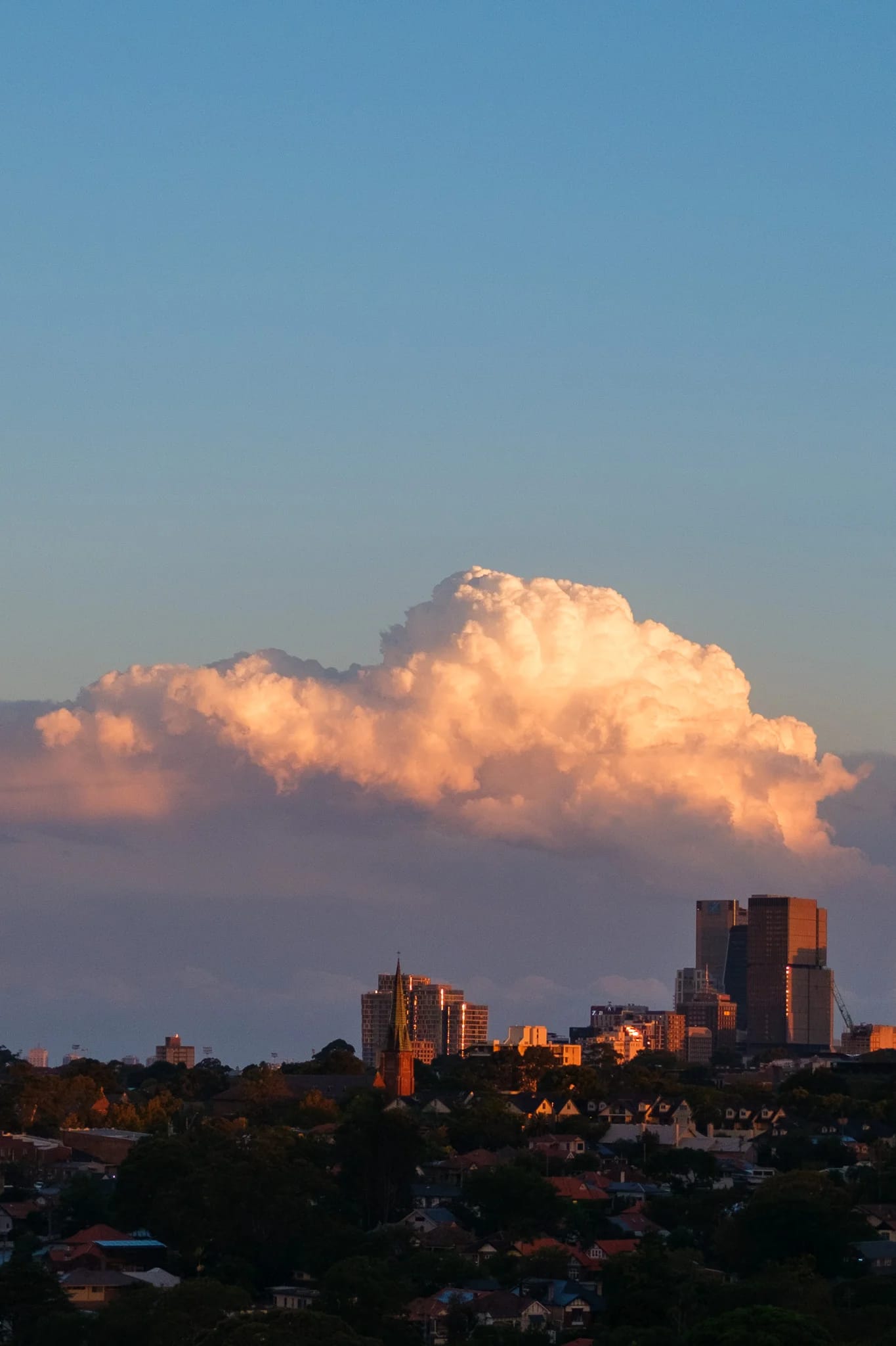 Sunset Cloud Over City Skyline