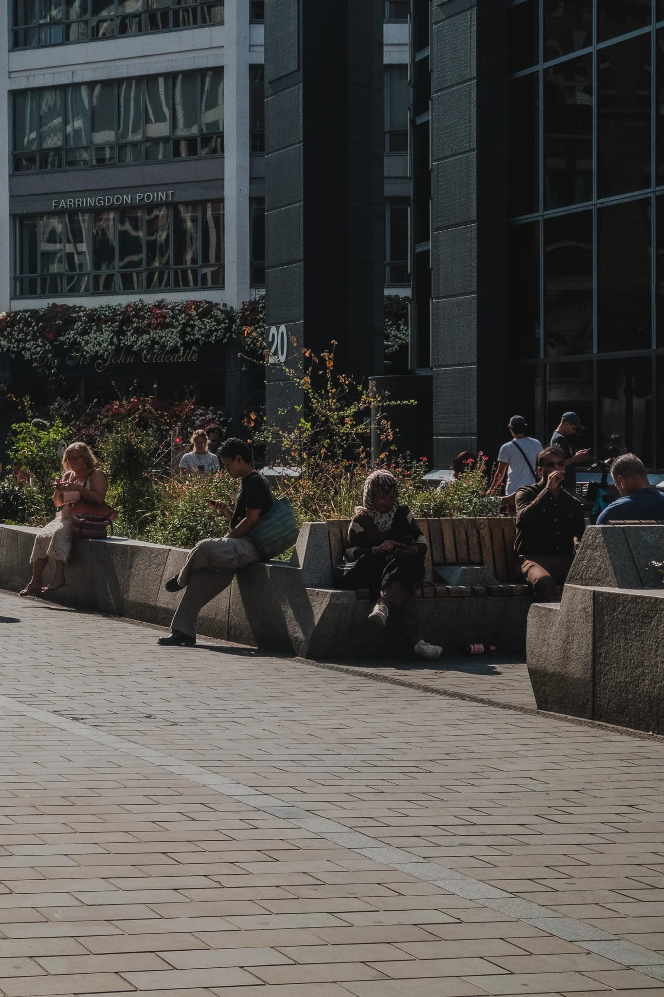 People relaxing by Farringdon Point building