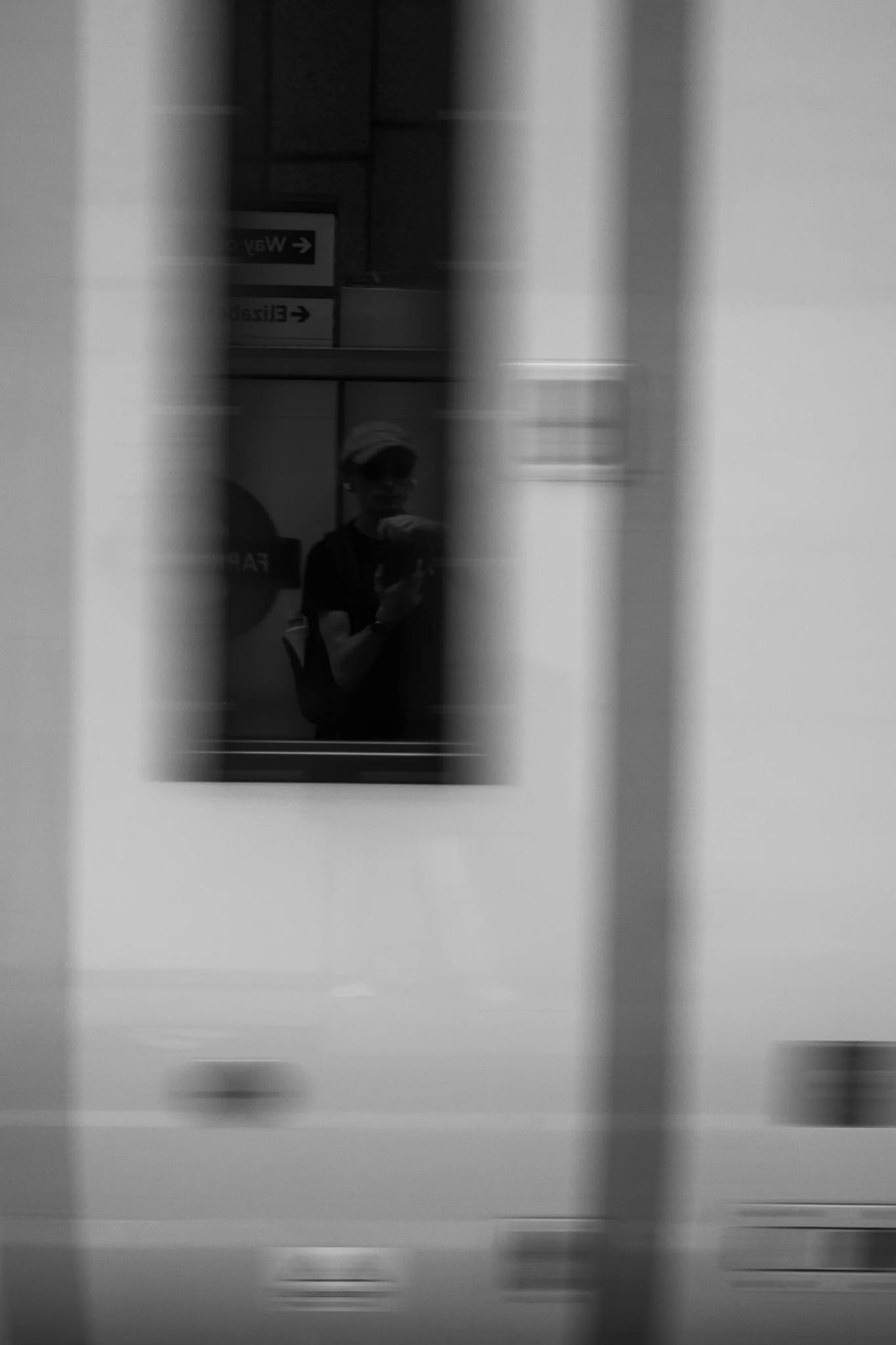 Reflected Figure in Moving Train