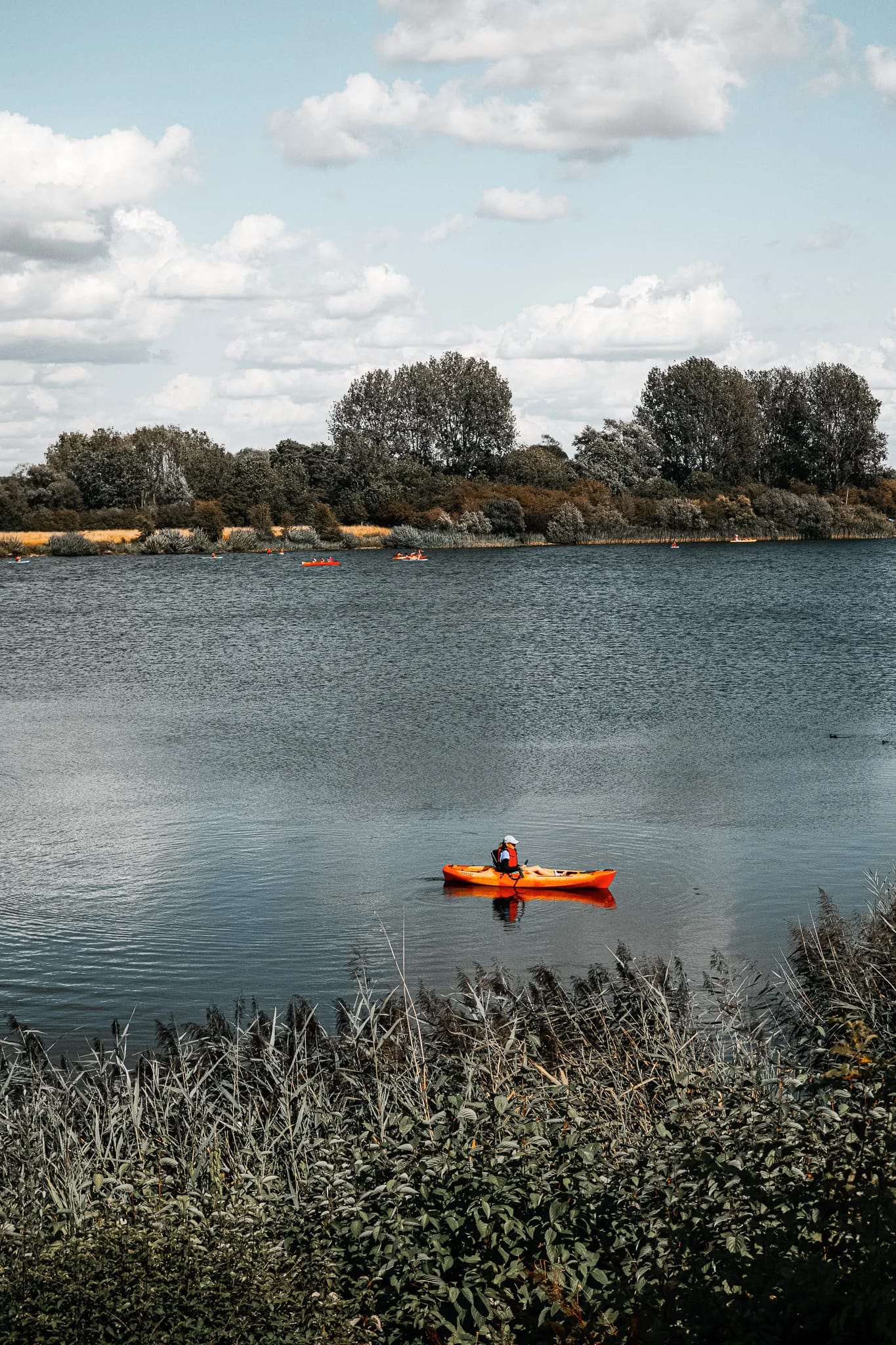 Solo kayaker on a calm lake