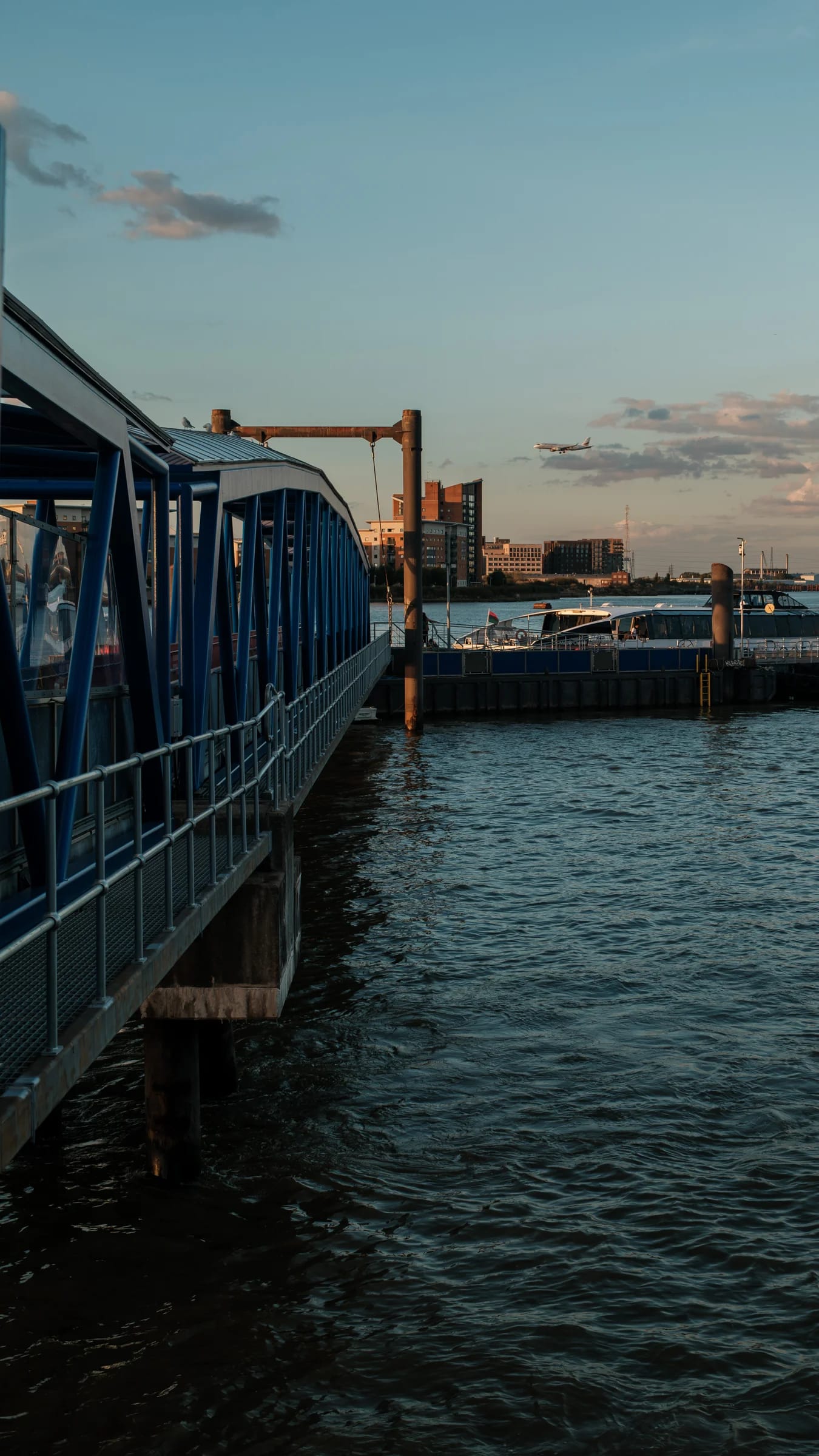 Blue Pier and River at Sunset