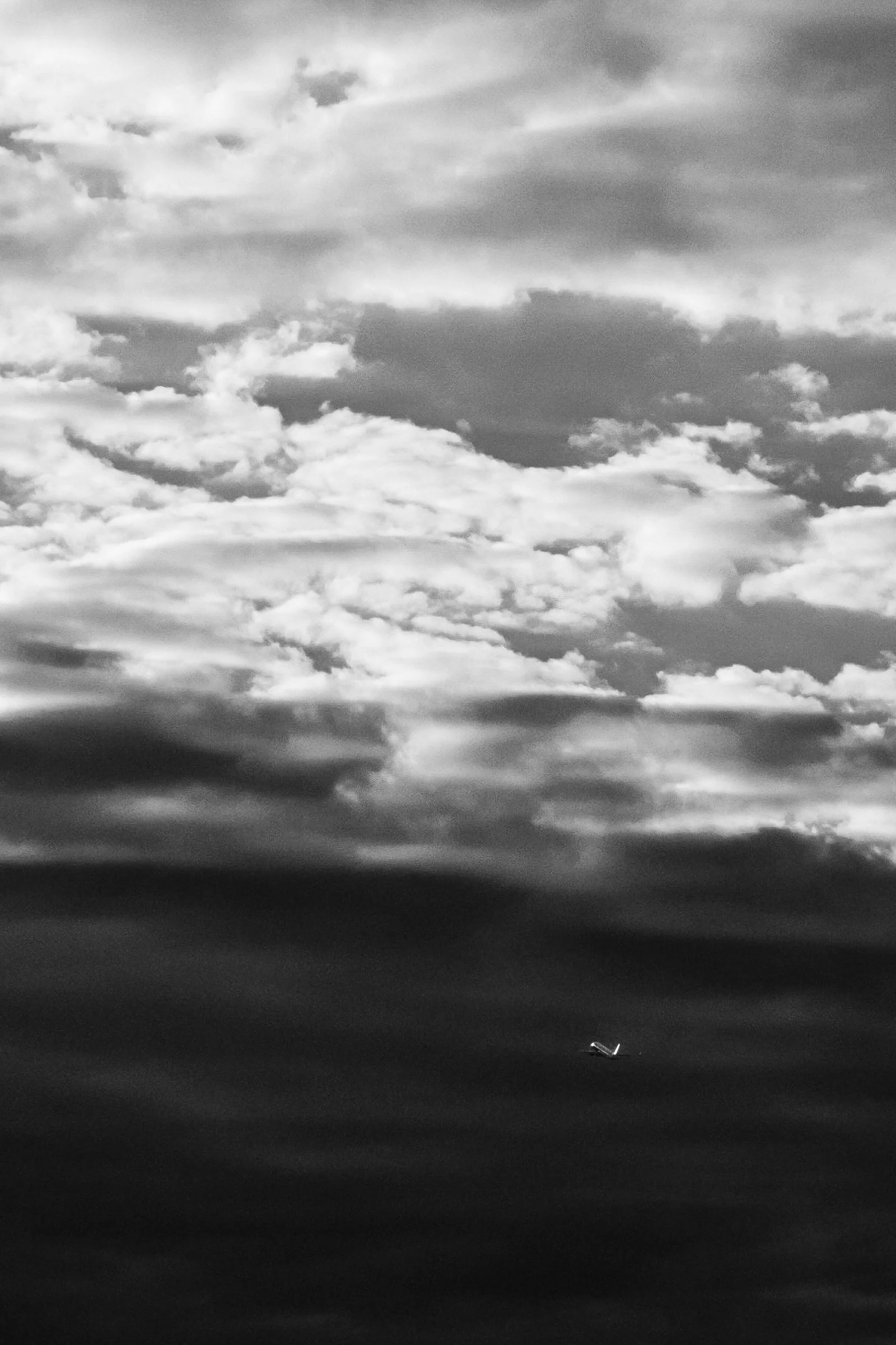 Dramatic Clouds Over Dark Horizon