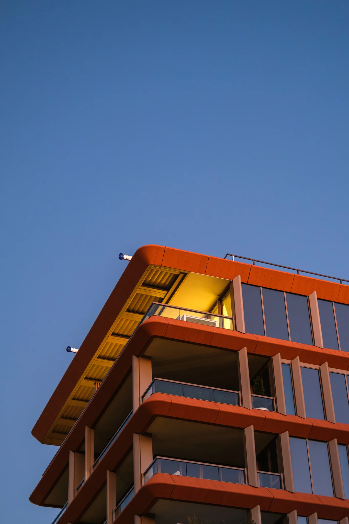 Orange Building with Illuminated Balcony