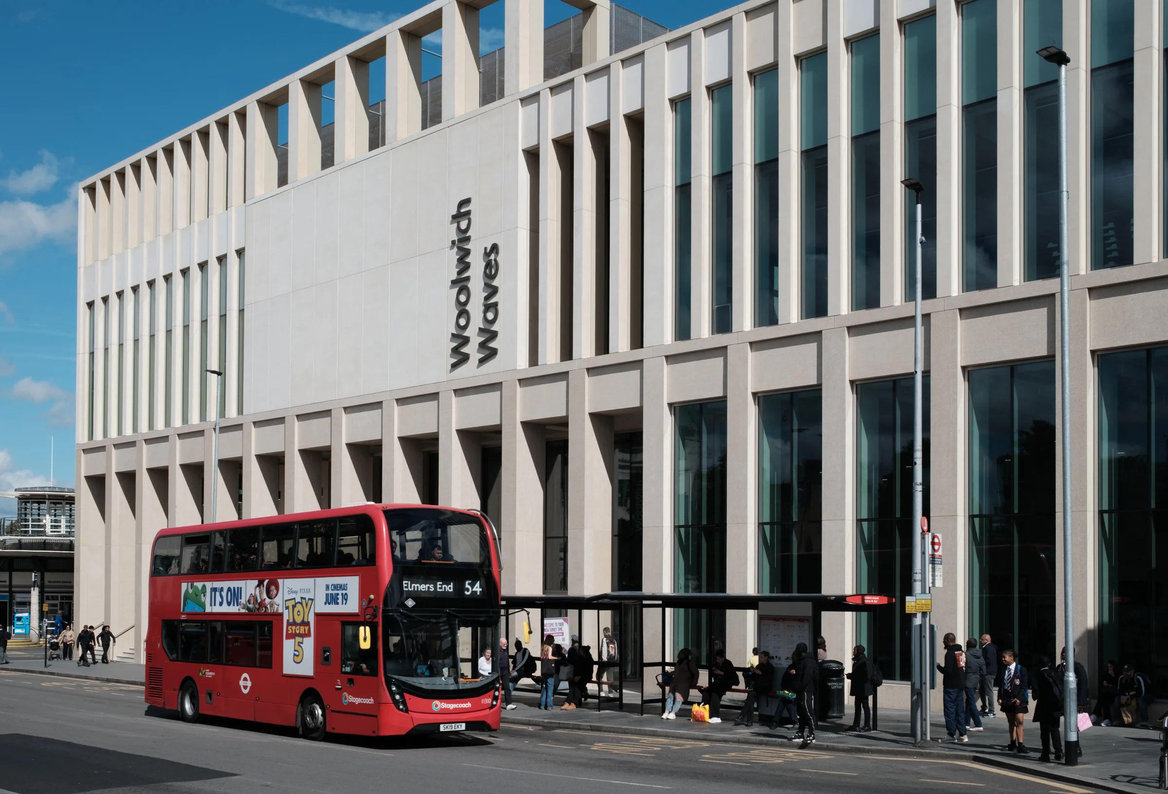 Woolwich Waves Building and Red Bus