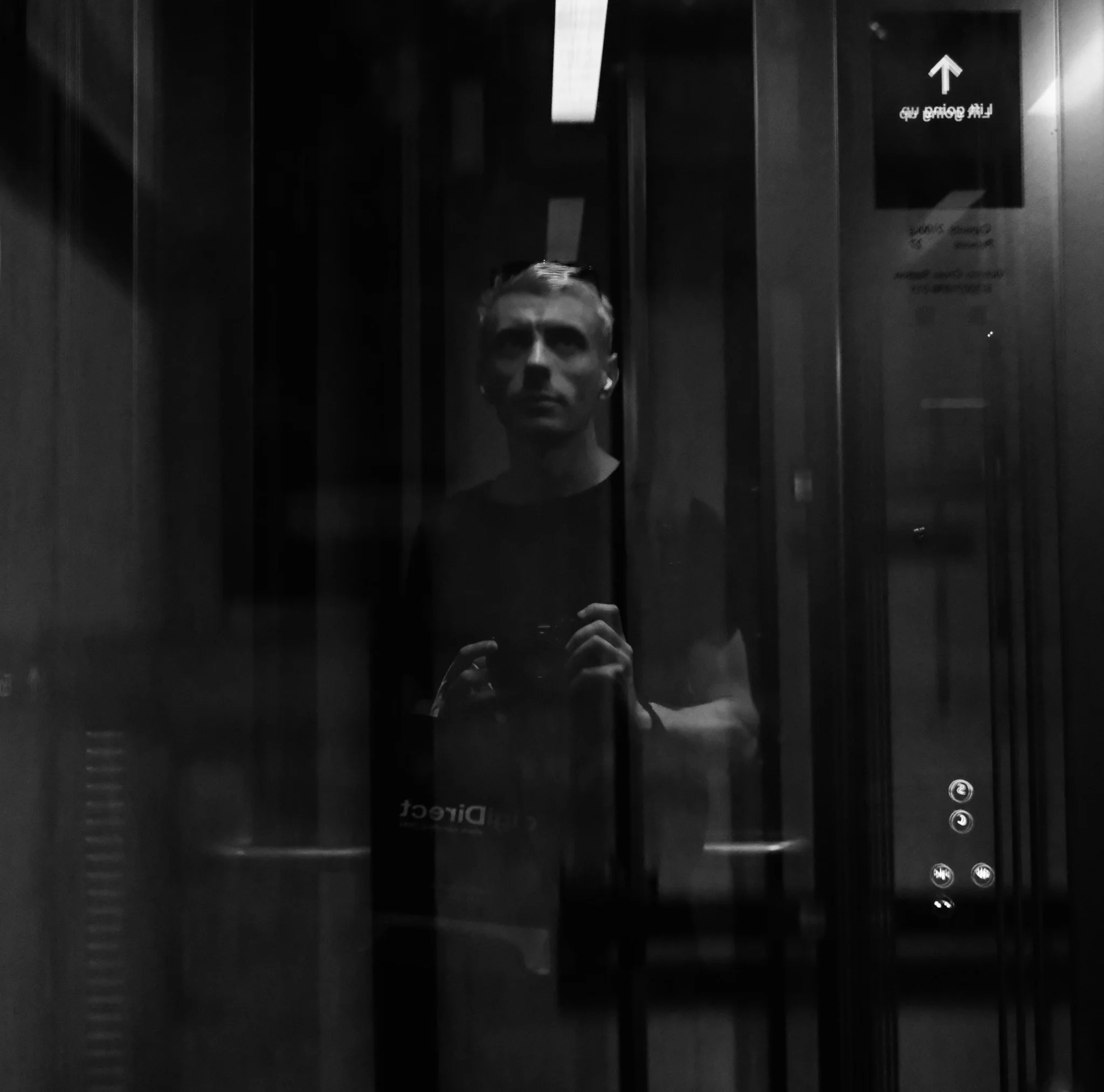 Reflected Man with Camera