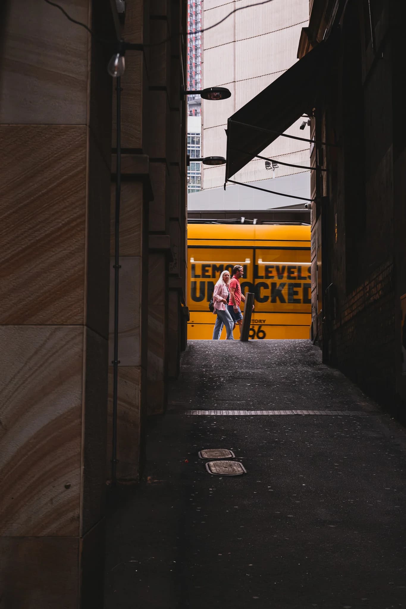 Yellow Tram in Alleyway