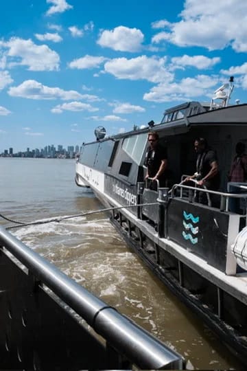 Thames Clipper departs with city skyline