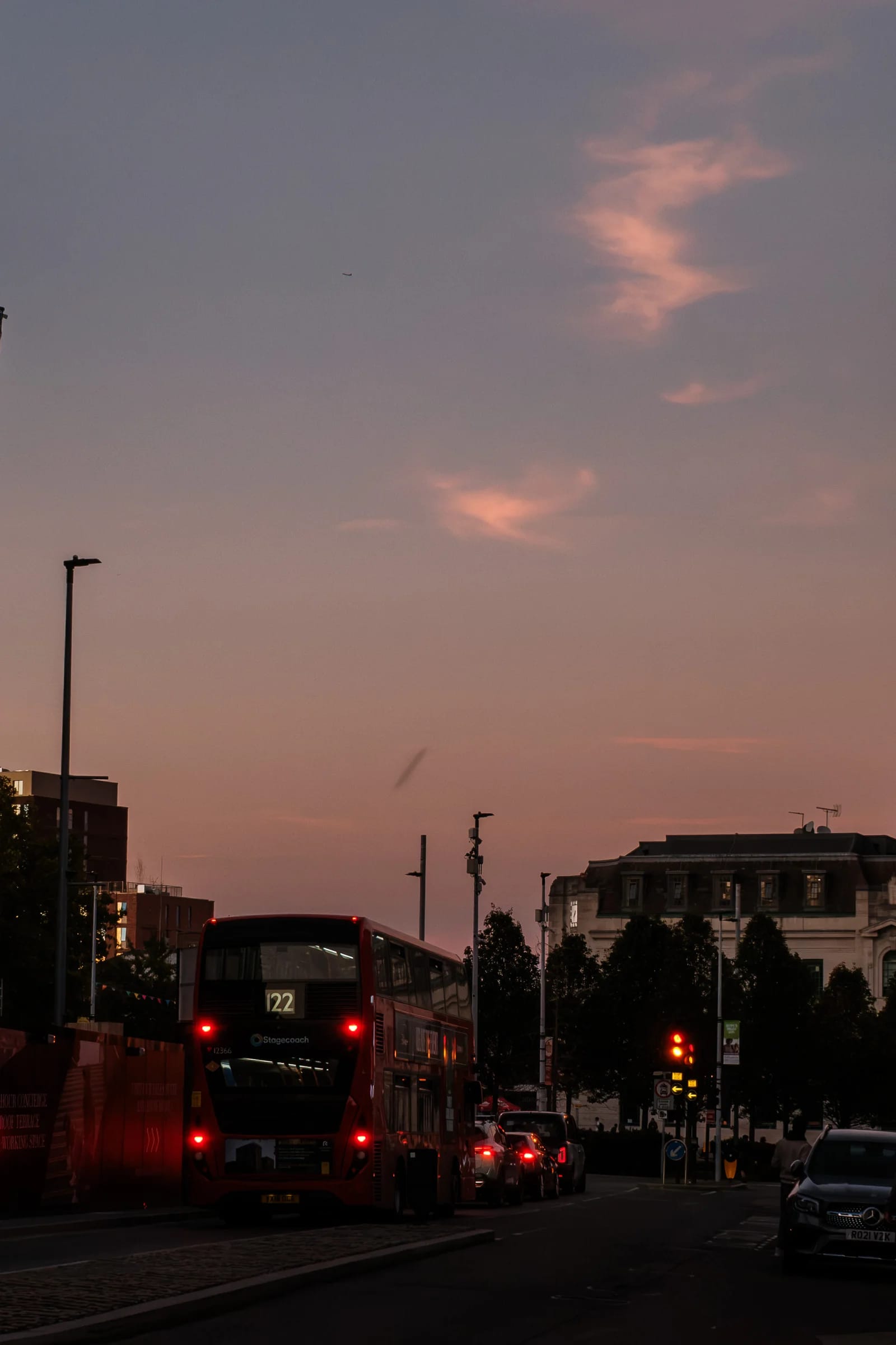 Red bus on city street